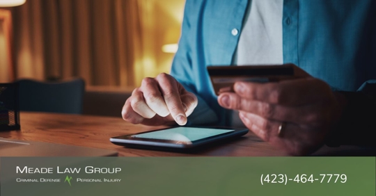 Man using a fraudulent credit card while online shopping